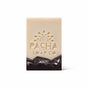 A rectangular, handcrafted Bar Soap by Pacha Soap Co. features a beige top, dark brown marbled bottom, and an embossed sunburst with the brand name. Made with nourishing oils. Presented on a plain white background.
