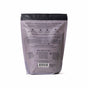 The back of a lavender Sleep Epsom Salt Bath Soak bag by Pacha Soap Co. displays calming bath soak benefits with Epsom salt and lavender, usage instructions, and brand info. The upright bag is set against a white background.