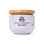 A lavender jar of Pacha Soap Co. Body Scrub with a whipped texture and light wooden lid is displayed against a white background.