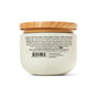 A white jar with a wooden lid and back label shows directions, ingredients, warnings, and barcode for Pacha Soap Co. Body Scrub—a gentle scrub with creamy whipped texture for face and body.