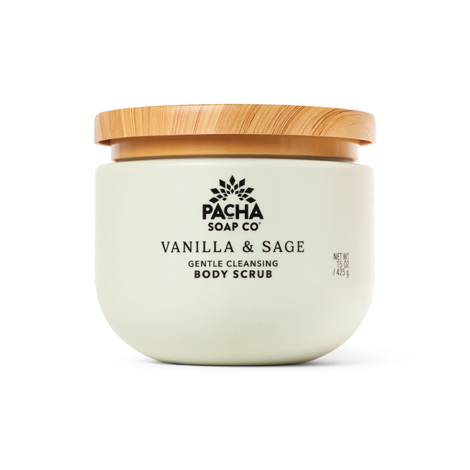 Pacha Soap Co. Body Scrub features a creamy, whipped texture in a light jar with black text and a wooden lid—a gentle exfoliant for soft, radiant skin.