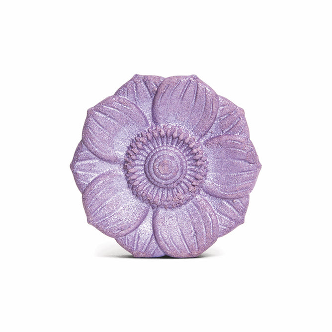 The French Lavender Froth Bomb by Pacha Soap Co. is a purple, shimmery flower-shaped bath bomb with detailed petals and a textured center, infused with skin-nourishing lavender essential oil and shown against a white background.