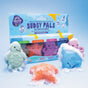 Four colorful animal-shaped Bar Soap Buddies (turtle, starfish, octopus, shark) with bubbles sit before a Pacha Soap Co. box. Made with moisturizing fruit oils, these gentle soaps are perfect for kids. Light blue background.