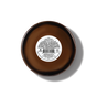 A brown circular container, the Fall Signature Candle - Amber Glass by Pacha Soap Co., is shown from above with a white center label featuring text and a barcode. The label provides instructions, ingredients, and safety warnings for these clean-burning candles, crafted with premium soy coconut apricot wax and unique house-designed fragrances.