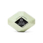 A hexagonal, light green bath bomb labeled Pacha Soap Co. Muscle Therapeutic Bath Bomb with soothing arnica, ideal for aromatherapy relaxation. Net weight: 6 oz (142 g).