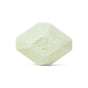 A pale green, hexagonal Muscle Therapeutic Bath Bomb by Pacha Soap Co. with gently rounded edges and a textured surface, shown against a white background—resembling an aromatherapy bath bomb.