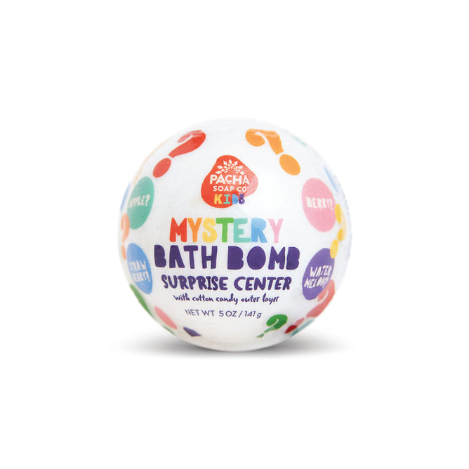 A colorful, round Mystery Bath Bomb by Pacha Soap Co. features a fruity scent and has illustrations of question marks and fruit names—Apple, Berry, Watermelon—on its white label.
