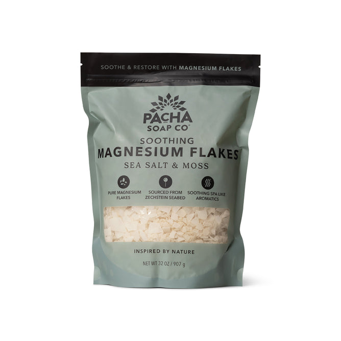 Pacha Soap Co. Salt Soak comes in a 32-ounce resealable bag with a green and white design and clear window. The mineral-rich Magnesium Flakes in Sea Salt & Moss are perfect for a soothing bath soak.