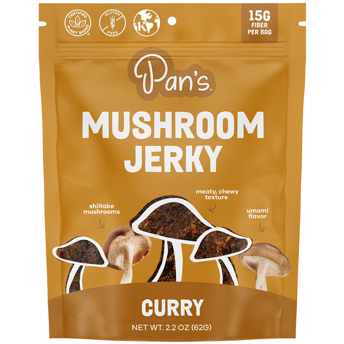 Pans Curry Mushroom Jerky is packaged in a brown bag with shiitake mushroom images, highlighting 15G Fiber and rich Umami flavor. This plant-based snack is gluten-free and vegan-friendly.