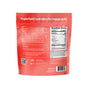 The back of a red blume SuperBelly Probiotic Hydration Powder pouch features nutrition facts, prep steps, brand mission, certifications, social media handles, and highlights the daily wellness benefits of superfoods and prebiotics.
