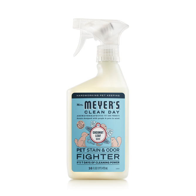 A 16 fl oz spray bottle of Mrs. Meyers Pet Stain & Odor Fighter, featuring a coconut leaf scent and floral label, offers 7 days of probiotic-fueled cleaning power against pet stains and odors.