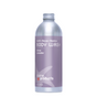 A silver aluminum bottle of Plaine Products Body Wash, Citrus Lavender, with a lavender label displaying "Refill • Reuse • Rejoice," "BODY WASH," and the Plaine Products logo for a skin-soothing experience.