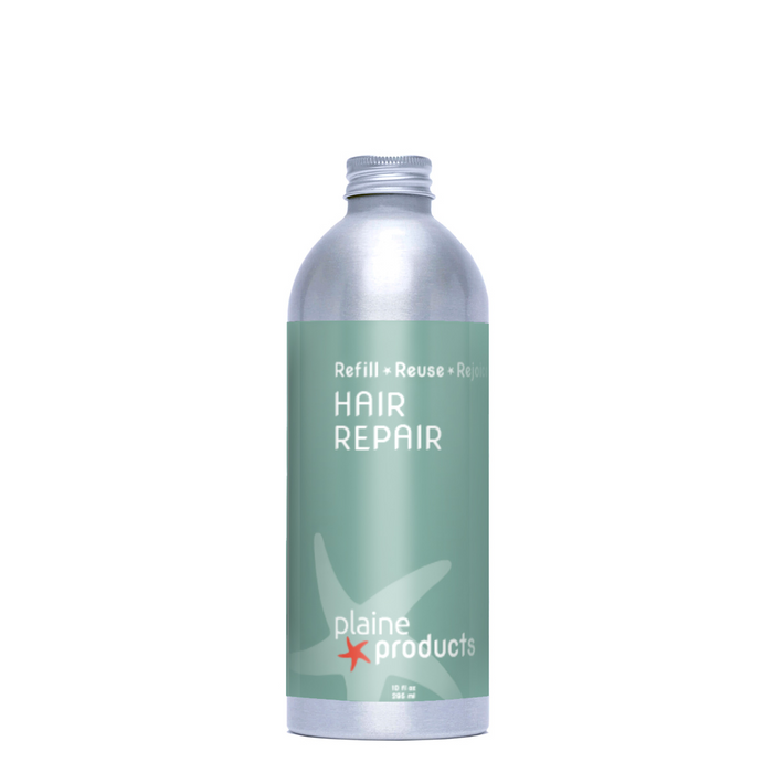A silver bottle with a green label reading "Hair Repair" by Plaine Products, featuring a starfish graphic. Ideal for daily use as a gentle detangler and perfect for hair repair.