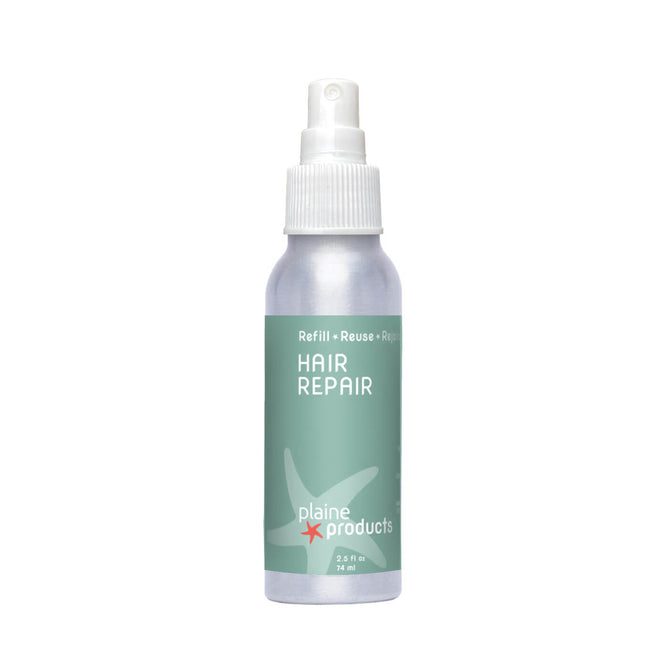 A small, refillable Plaine Products Hair Repair spray bottle with a mint green label, white starfish graphic, and white spray cap. This detangler cares for your hair while supporting reusing and recycling.