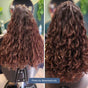 Side-by-side photos show long, curly brown hair before and after using Plaine Products Styling Gel: left is frizzy and undefined, right features shiny, well-defined curls thanks to this nourishing gel.