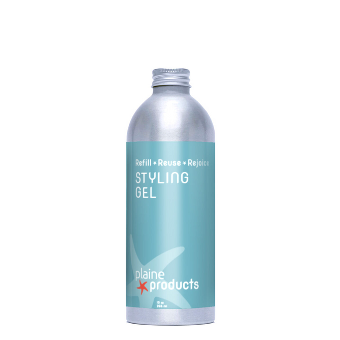 A silver aluminum bottle with a blue label reading “Styling Gel” from Plaine Products, featuring an aloe-based formula, light starfish graphic, and brand logo—ideal for those seeking vegan hair care.