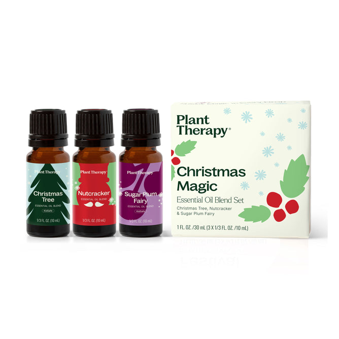 Three amber bottles of Plant Therapys Christmas Magic Essential Oil Blend 3-Set are displayed beside a festive white box—ideal for holiday essential oil blends and seasonal aromatherapy.