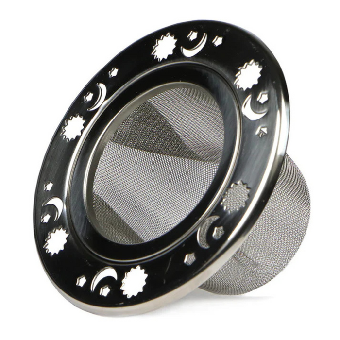 The Plum Deluxe Celestial Mesh Tea Infuser is a round stainless steel strainer with a fine mesh base and decorative star, sun, and crescent moon cutouts on the outer rim.