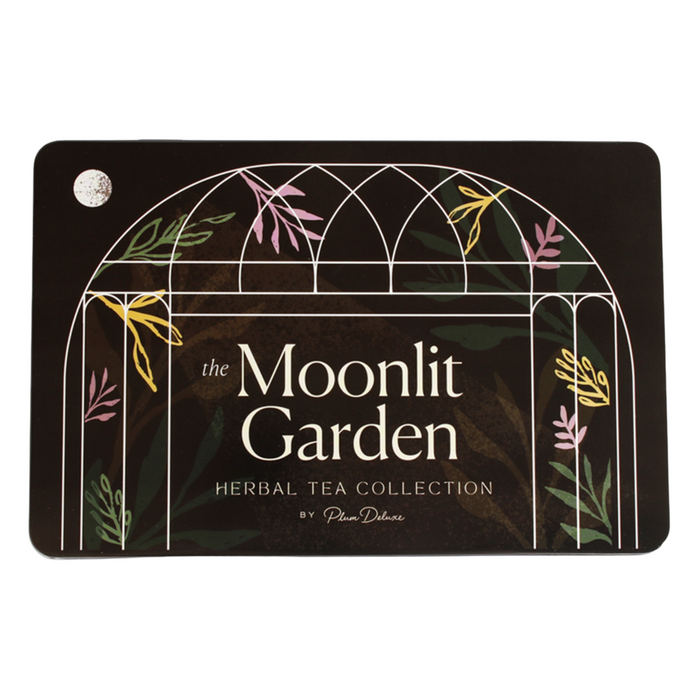 The Tea Gift Tin - Moonlit Garden by Plum Deluxe features an arched window design with vibrant leafy and floral art on a dark backdrop—an ideal gift tin filled with signature herbal teas.