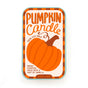 Rectangular Soy Wax Candle by The Neighborgoods in a reusable tin with a label featuring an orange pumpkin, the text Pumpkin Candle, and a scent description of warm pumpkin spice with a hint of vanilla.