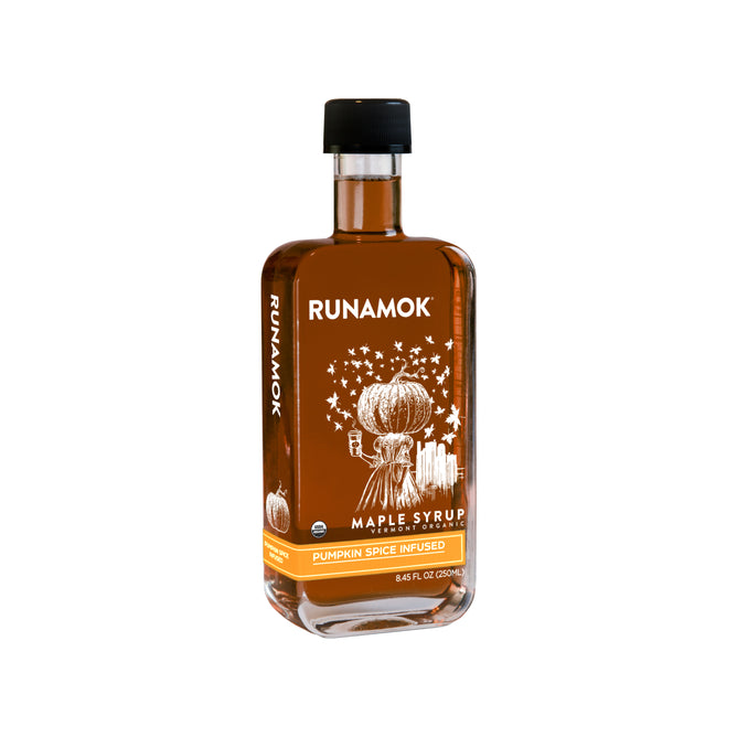 Runamoks Pumpkin Spice Infused Maple Syrup comes in a clear glass bottle with a black cap and orange pumpkin label, featuring rich amber syrup that captures classic autumn flavors.