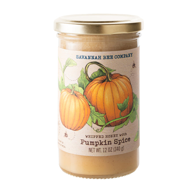 A 12 oz (340 g) jar of Savannah Bee Company Pumpkin Spice Whipped Honey features two pumpkins and green vines on the label, offering a creamy, spreadable wildflower honey with the sweet flavor of fall.