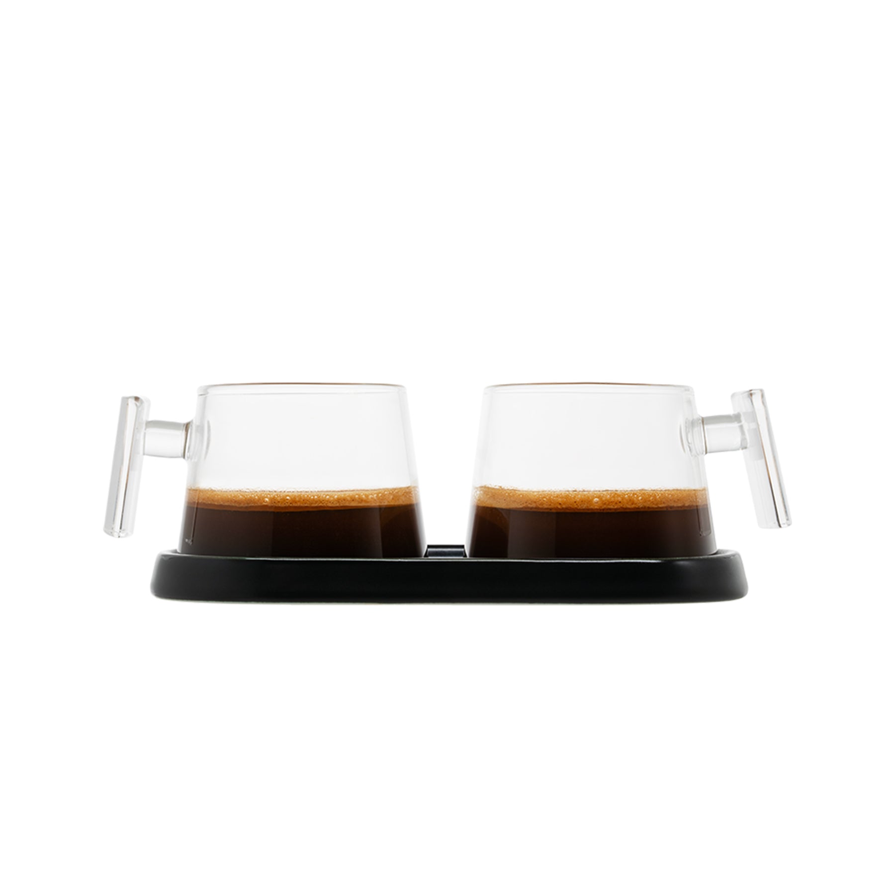 A set of two Pure Over Espresso Cups (3.5 oz), each with a handle and filled with espresso, are displayed side by side on a black tray against a white background.