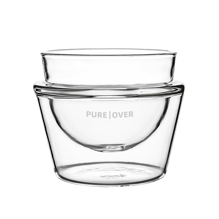 A Pure Over Cappuccino Cup (6.5 oz) with double-walled clear glass and "PURE | OVER" etched on the side, shown on a white background.