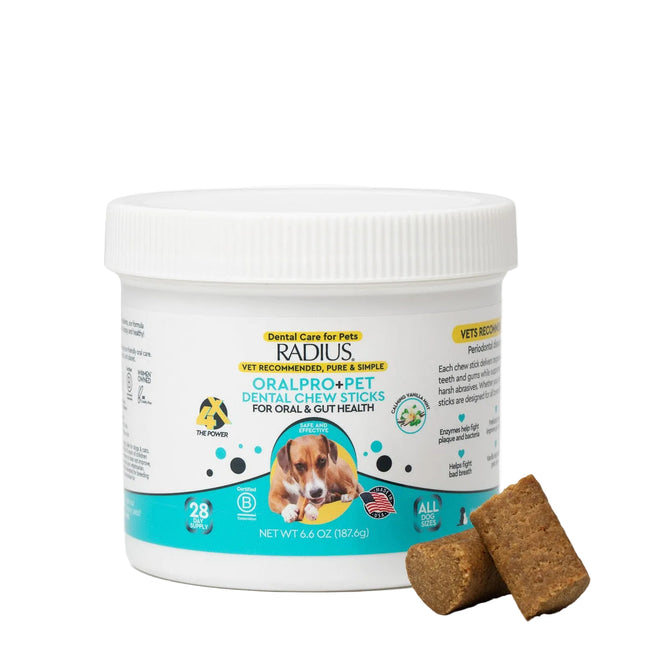 A white container of Radius OralPro+ Pet Dental & Gut Chew Sticks for Dogs features a dog image on the label. Two brown chew sticks are positioned in front of the container. The label promotes enzymatic plaque support and prebiotic gut health benefits for your pet.