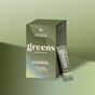 A green box labeled Rookie Wellness Greens in crisp apple flavor sits next to a matching single-serve packet. The box reads: Two weeks to better gut health*—with fiber and antioxidants, on a green gradient background.