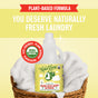 A bottle of Rebel Green Fresh Laundry Detergent Liquid - 3x Concentrated sits in a wicker basket filled with white towels, highlighting its gentle, eco-friendly USDA organic formula for naturally fresh laundry.