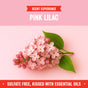 A digital image of a pink lilac flower with green leaves on a pastel pink background. Text above reads Rebel Green Fresh Laundry Detergent Liquid - 3x Concentrated; below, USDA certified, sulfate free, with essential oils.