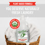 A Rebel Green Fresh Laundry Detergent Liquid - 3x Concentrated bottle sits in a wicker basket with white towels. Text reads: "You deserve naturally fresh laundry" and highlights its gentle, plant-derived, eco-friendly formula.