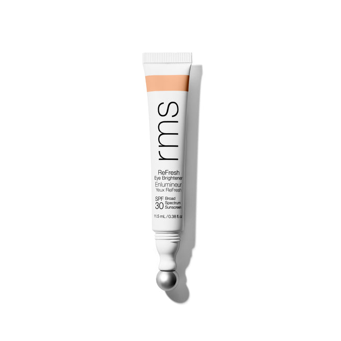 A tube of RMS Beauty ReFresh Eye Brightener Broad Spectrum SPF 30, with a silver applicator tip and minimalist white packaging, is shown on a white background. Lightweight and protective, it’s ideal for daily undereye care.