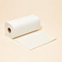A roll of Reel Premium Bamboo Paper Towels (135 2-ply sheets) with one sheet partially unrolled is displayed on a light beige background.