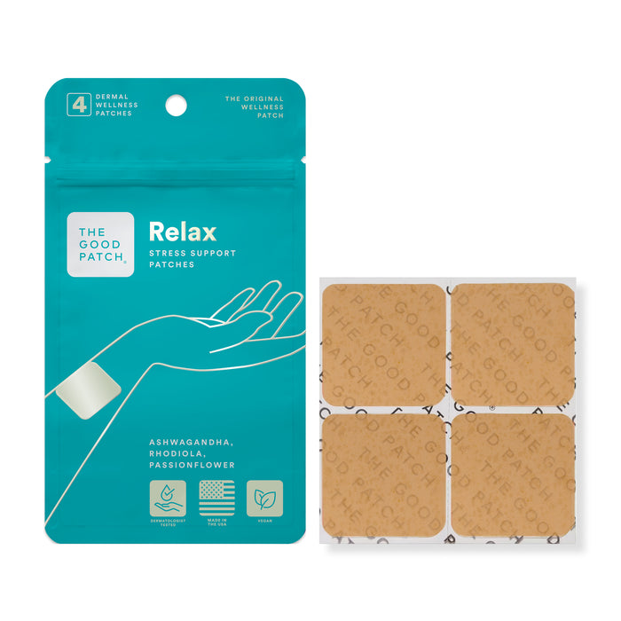 A teal pouch of The Good Patch Relax Stress Support Patches next to a sheet of four square, tan adhesive patches.