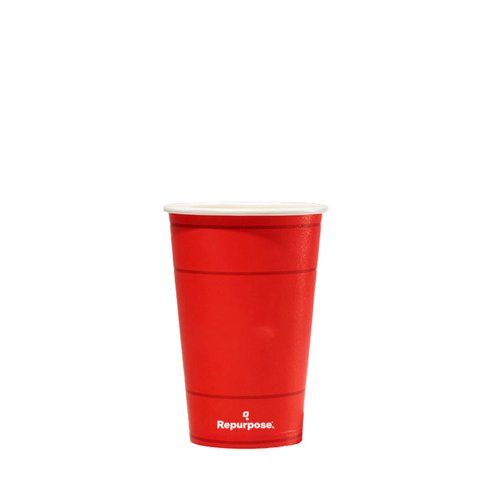 A red reusable cup from Repurpose, highlighting its eco-friendly nature, is shown against a plain white background. Ideal for those seeking sustainable alternatives to traditional party cups.