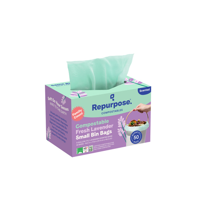 A box of Repurpose Compostable Small Bin Bags, Lavender Scented, with a green bag visible. The package contains 50 eco-friendly, home-compostable trash bags featuring a pleasant lavender scent.