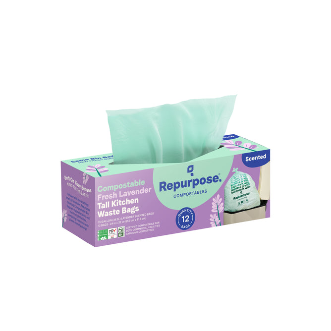 A box of Repurpose Compostable Tall Kitchen Bags, Lavender Scented, with a light green bag partially pulled out. The box shows it contains 12 home-compostable kitchen bags.