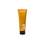 Back of an amber-colored Acure Resurfacing 1% Glycolic Acid & Unicorn Root Cleanser squeeze tube with black text, including ingredients, instructions, and a barcode.