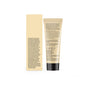 A beige tube of Acure Revived Radiance Overnight Mask and its matching box stand upright, showing text with ingredients like vegan collagen plus recycling, cruelty-free, and skin firmness icons on the back.