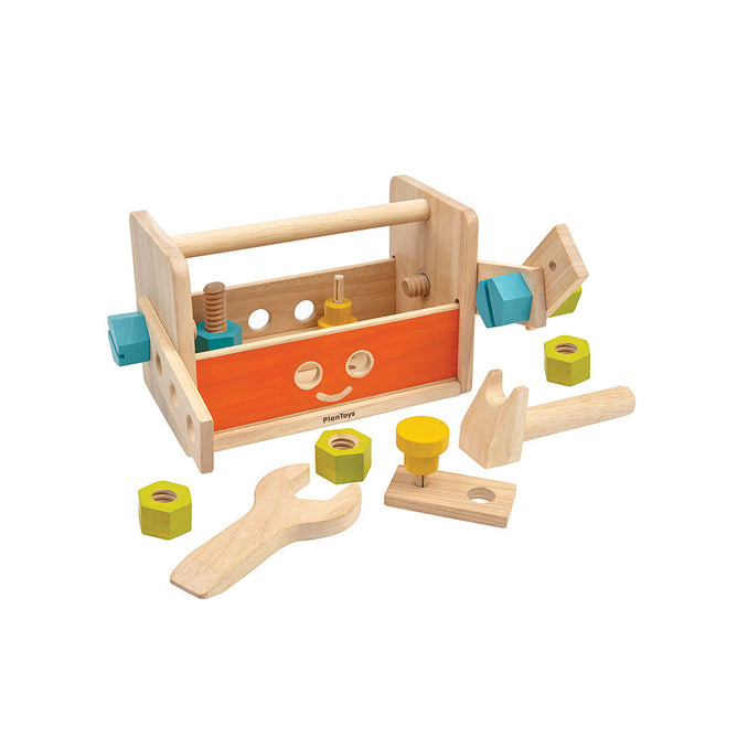 The PlanToys Robot Toolbox features an orange side panel and includes toy tools like a wrench, hammer, nuts, bolts, and colorful construction pieces—an ideal creative building set for young builders.