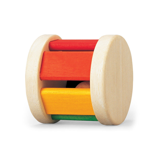 The PlanToys Wooden Roller Rattle Toy for Babies features two circular ends and four colorful slats (red, orange, yellow, green). This sustainable toy promotes sensory exploration and early development as babies roll and play with it.