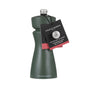 A dark green Cole & Mason 2-in-1 Kenton Salt & Pepper Mill with a silver top features a ceramic grinder. A black tag on the neck shows the brand name and provides instructions for using the ceramic mechanism.