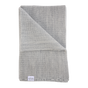 The Sawa - Moon Stone light gray merino baby blanket folded over itself.