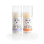 The Savannah Bee Company’s Heel Balm and Body Balm Gift Set is shown, featuring two cylindrical tubes—one with the Honey & Beeswax Body Balm, Rosemary Lavender, a natural skin moisturizer, and the other with the Beeswax Heel Balm in Tangerine Spearmint—both displayed against white backgrounds.
