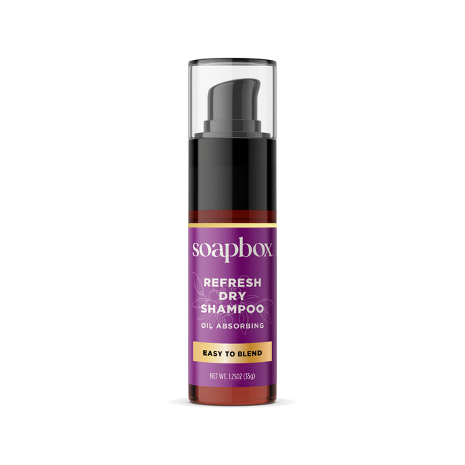Soapbox Refresh Dry Shampoo, enriched with rice protein for fuller hair and oil absorption, comes in a black bottle with a purple label and clear cap. Easy to Blend and Net Wt. 1.25oz (35g) appear at the bottom.