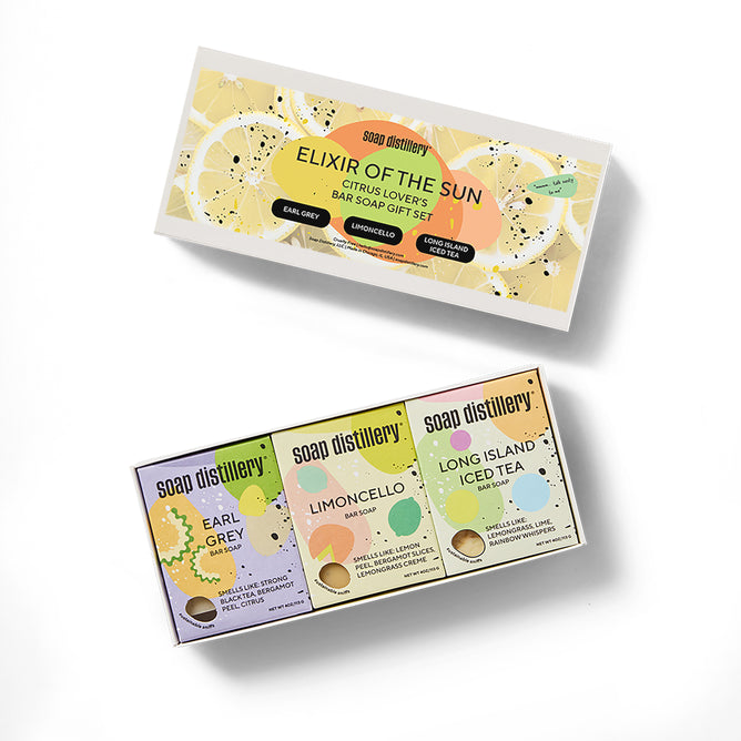 Soap Distillery’s Elixir of the Sun Three Soap Gift Set includes Earl Grey, Limoncello, and Long Island Iced Tea citrus bar soaps in vibrant packaging—an uplifting gift for citrus lovers.