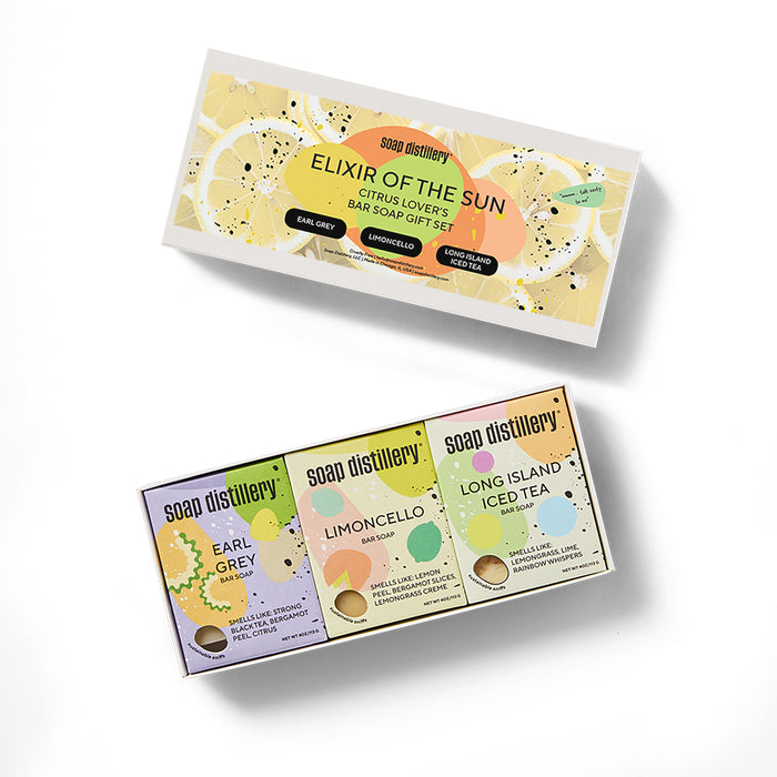 Soap Distillery’s Elixir of the Sun Three Soap Gift Set includes Earl Grey, Limoncello, and Long Island Iced Tea citrus bar soaps in vibrant packaging—an uplifting gift for citrus lovers.
