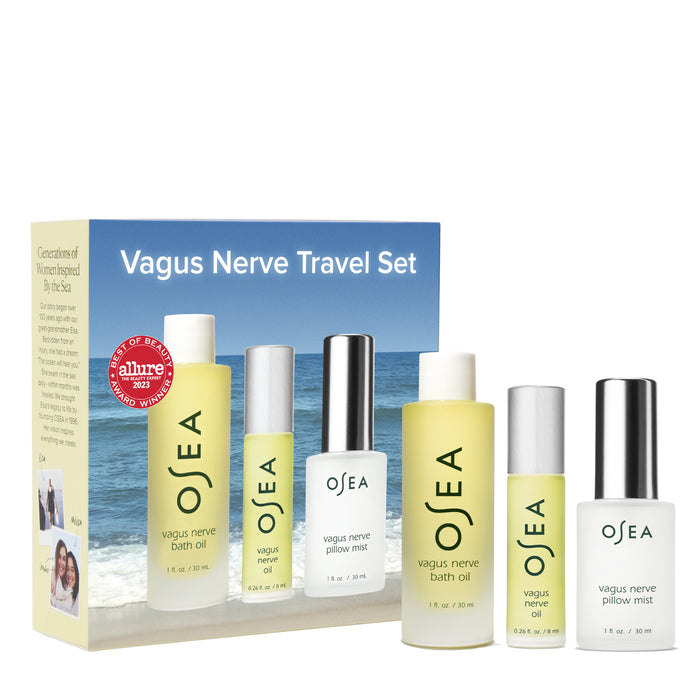 The OSEA Vagus Nerve Travel Set includes bath oil and pillow mist in travel-sized bottles, packaged before a box with ocean-inspired branding—ideal for relaxation wherever your wellness journey goes.